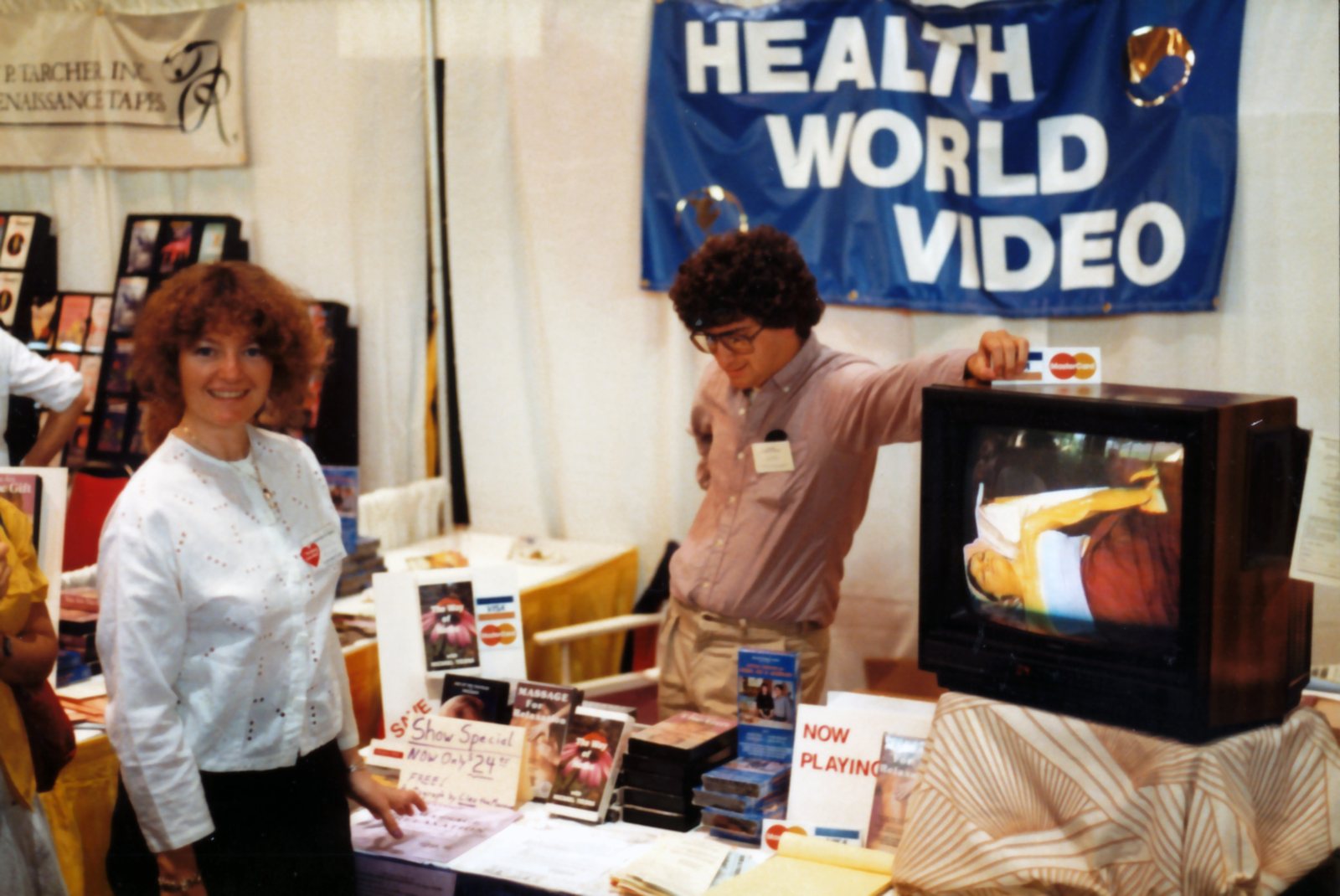 The Health World Video booth, with Massage for Relaxation on the table and playing on a TV monitor
